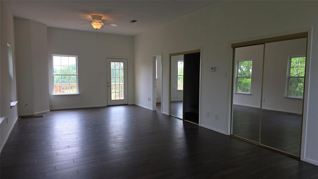 2474 Joe Davis Road Whitewright, TX 75491 - Photo 5 of 12 Main bedroom and bath upstairs with deck out the back door
