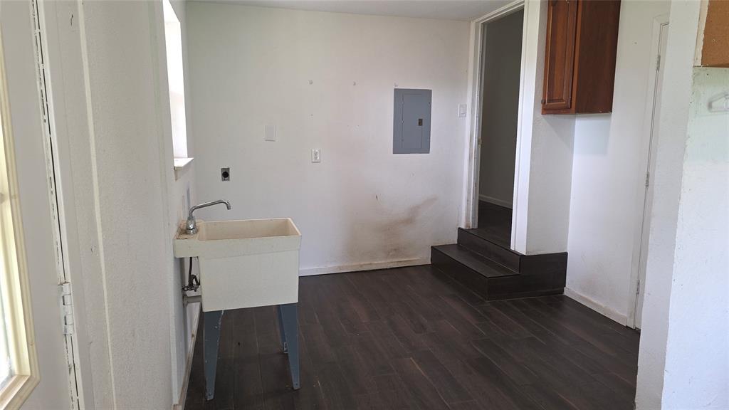 2474 Joe Davis Road Whitewright, TX 75491 - Photo 6 of 12 Interior space featuring dark wood-finish flooring and white walls