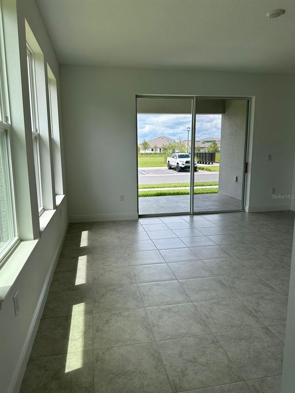 19044 Blueleaf Street Orlando, FL 32827 - Photo 15 of 42 a view of an empty room with a window