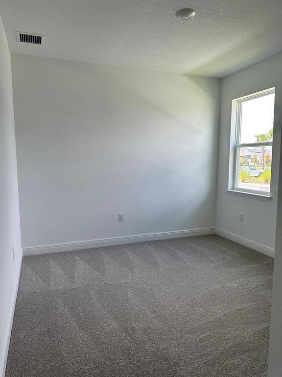 19044 Blueleaf Street Orlando, FL 32827 - Photo 19 of 42 an empty room with a window