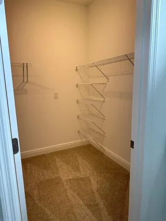 a bathroom with a granite countertop sink and mirror