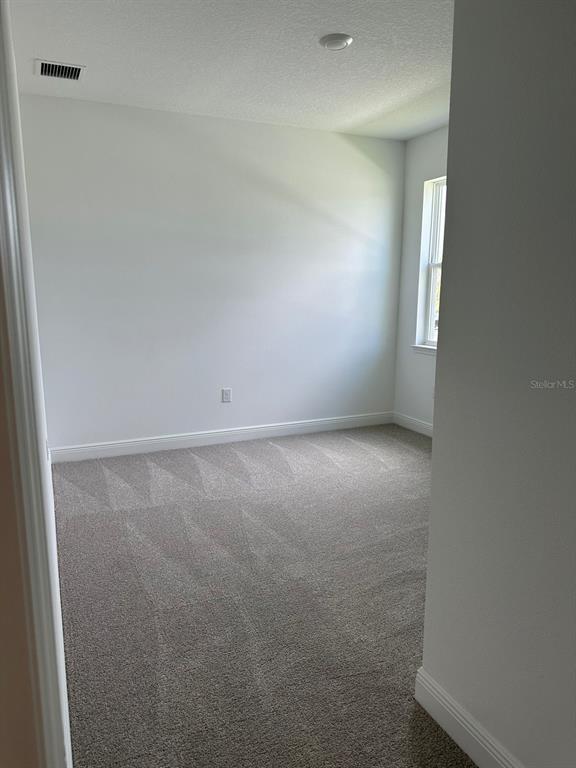 19044 Blueleaf Street Orlando, FL 32827 - Photo 36 of 42 en empty room with window
