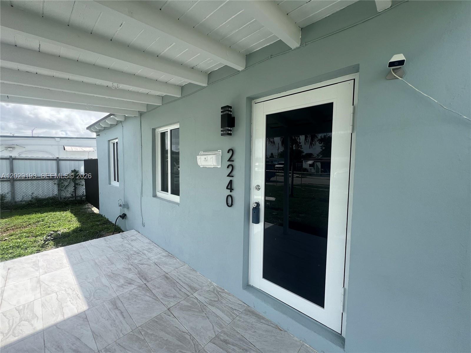 2240 Rutland Street Opa-Locka, FL 33054 - Photo 7 of 11 a view of a porch