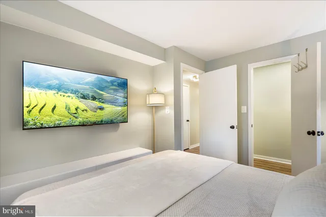 a bedroom with bed and window