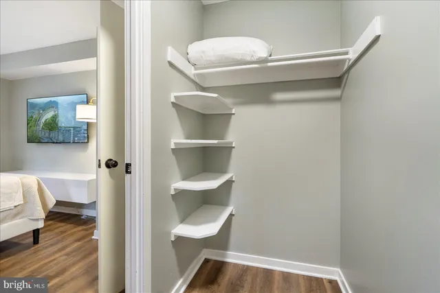 a view of small space with wooden floor and chair