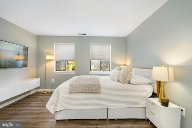 a bedroom with a bed and a couch