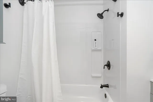 a close up of a bathtub curtain