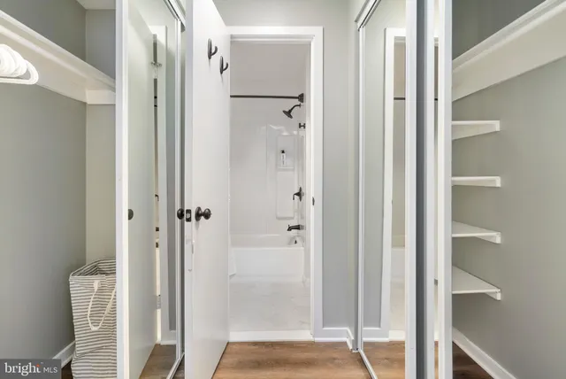 a bathroom with a shower and a glass door