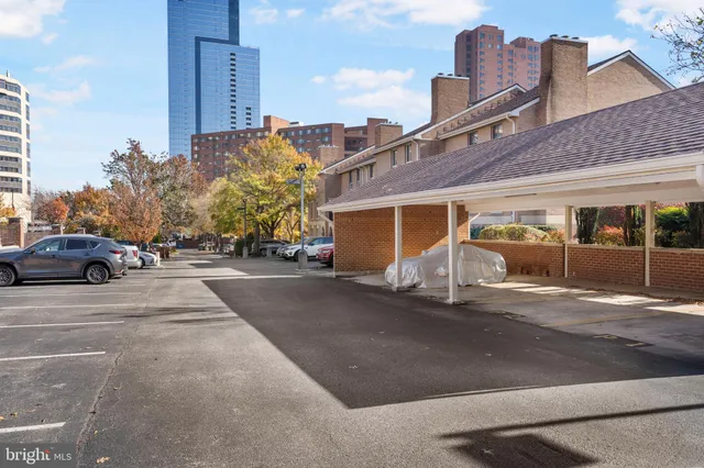 a view of a street with a building in the background