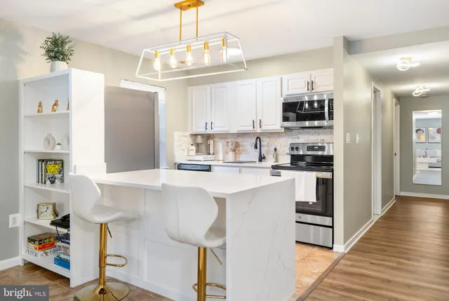 a kitchen with refrigerator and window