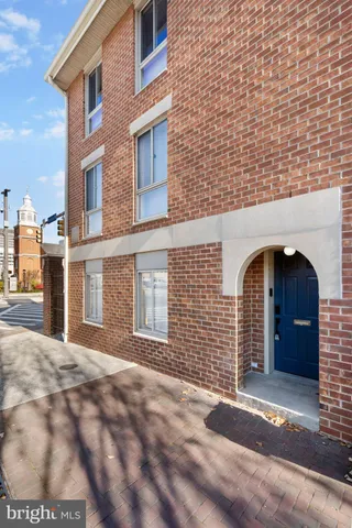 a view of a brick building with many windows