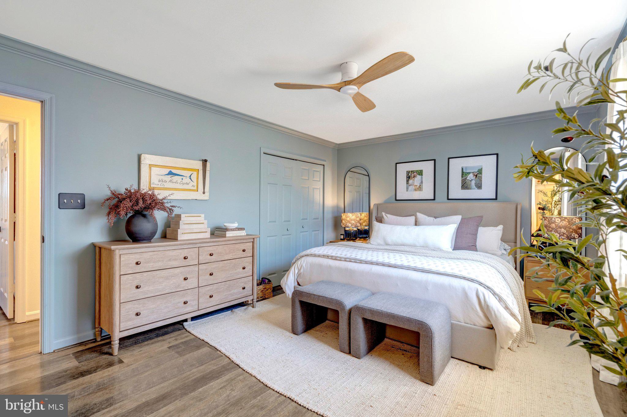 8585 Short Street Manassas, VA 20112 - Photo 16 of 31 a spacious bedroom with a bed and a dresser