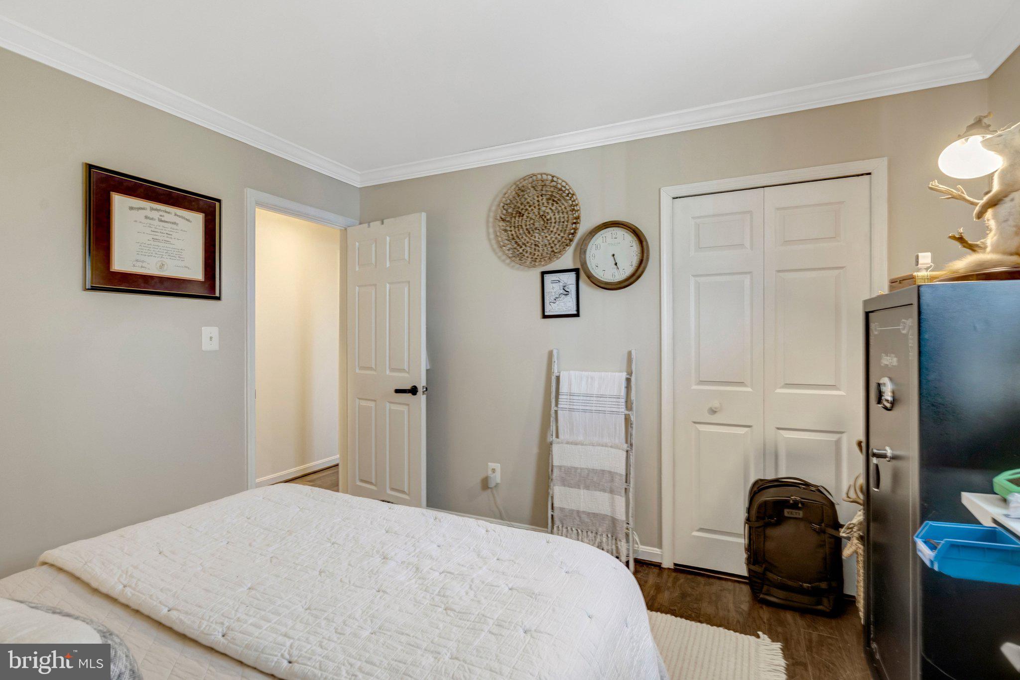 8585 Short Street Manassas, VA 20112 - Photo 22 of 31 a bedroom with a bed and a closet