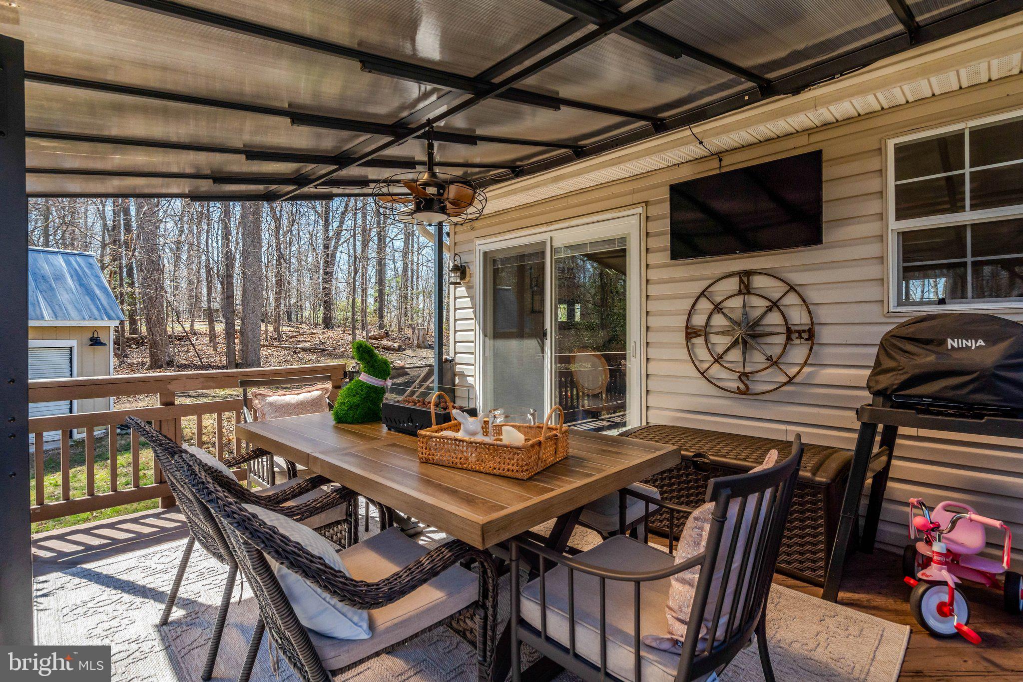 8585 Short Street Manassas, VA 20112 - Photo 26 of 31 a view of a dinning table and chairs in the patio