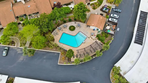 an aerial view of a house with a swimming pool