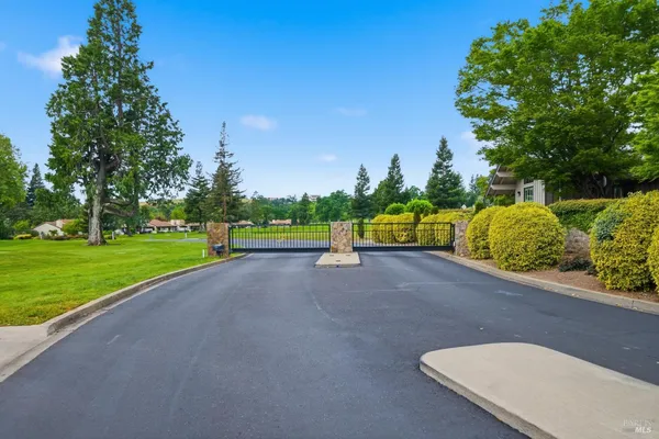 a view of a street with a park