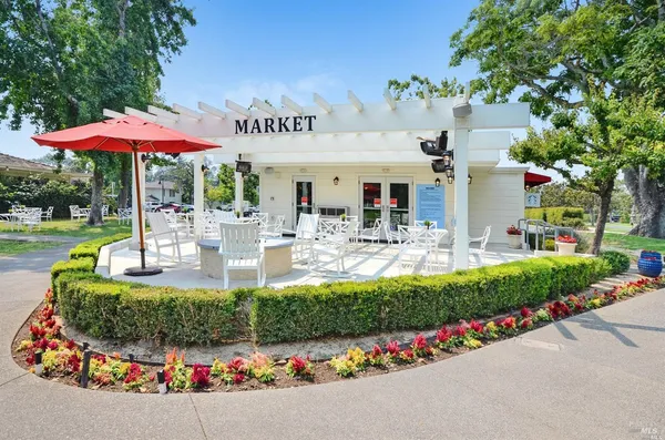 an outdoor space with lots of yellow lighting