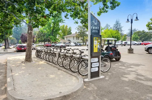 a view of bike storage next to a yard