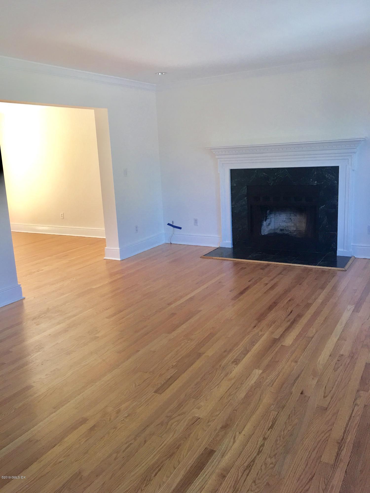 16 Ritch Avenue, Unit B Greenwich, CT 06830 - Photo 4 of 12 a view of empty room with a fireplace