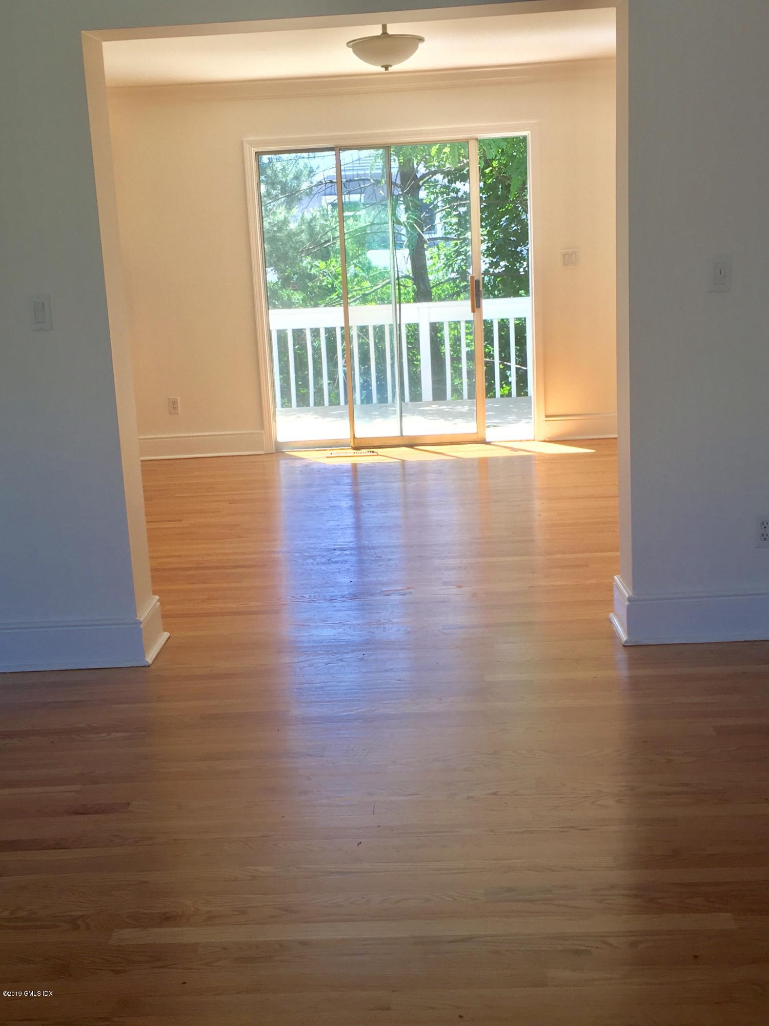 16 Ritch Avenue, Unit B Greenwich, CT 06830 - Photo 5 of 12 a view of empty room with wooden floor and fan