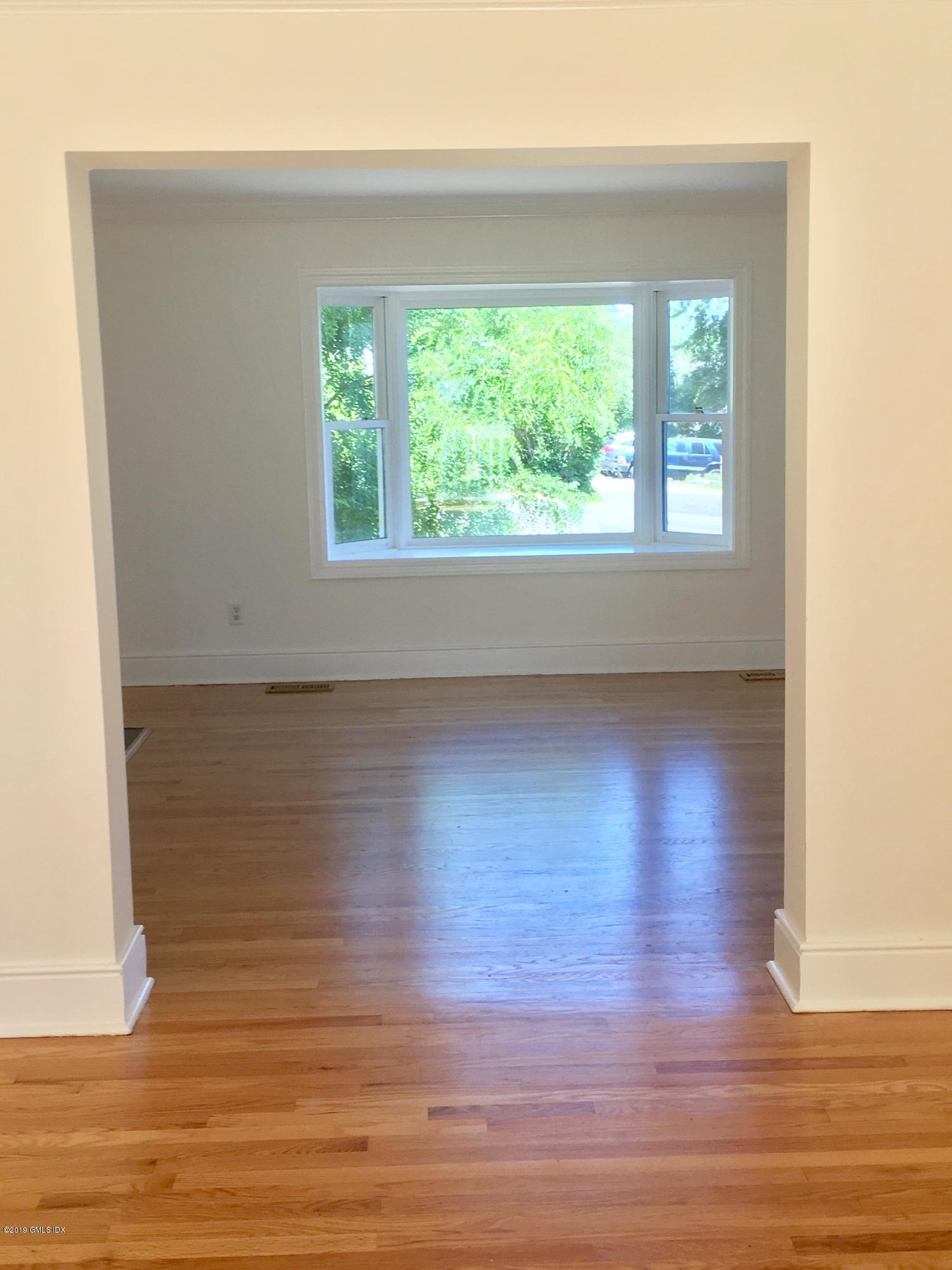16 Ritch Avenue, Unit B Greenwich, CT 06830 - Photo 7 of 12 a view of a room with wooden floor and window