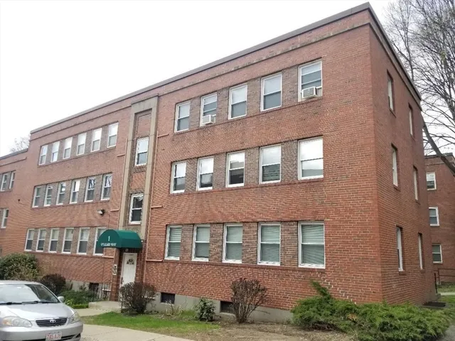 a front view of a building with yard