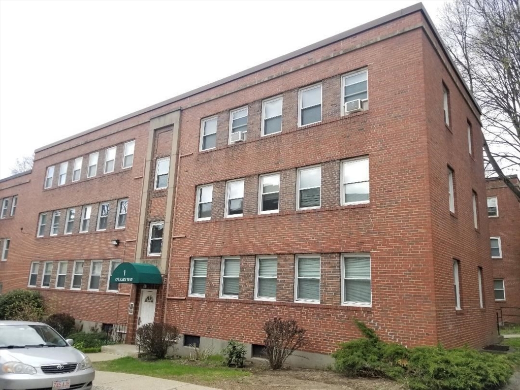 1 O'Leary Way, Unit 91 Boston, MA 02130 - Photo 1 of 12 a front view of a building with yard