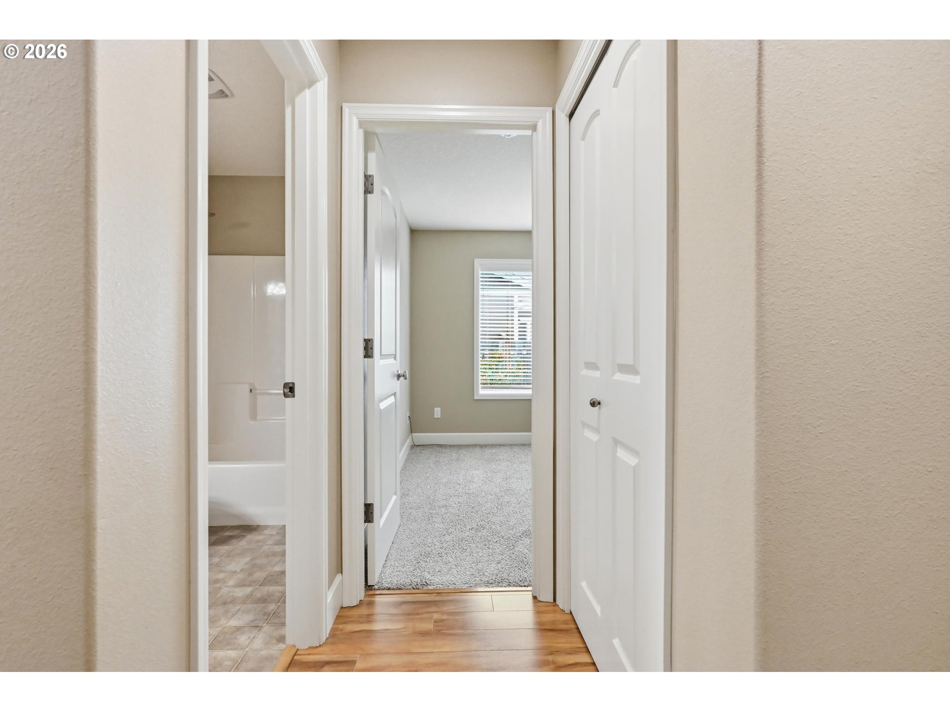 1075 Sage Street Silverton, OR 97381 - Photo 9 of 46 a view of a bathroom from a hallway