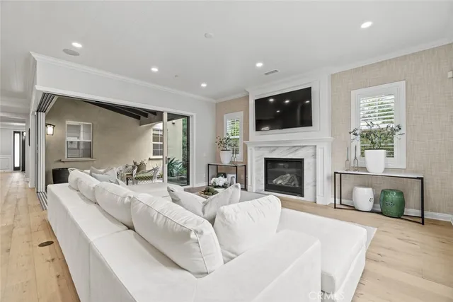 a living room with furniture fireplace and flat screen tv