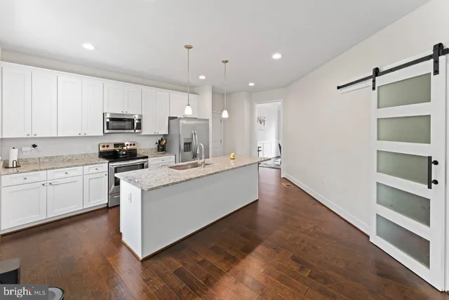 a large kitchen with cabinets