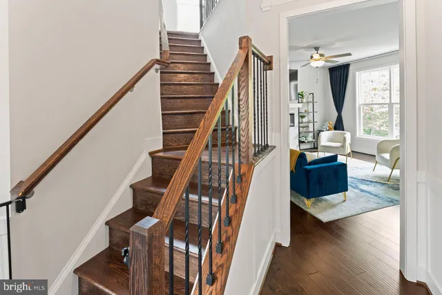 a view of entryway and hall with wooden floor