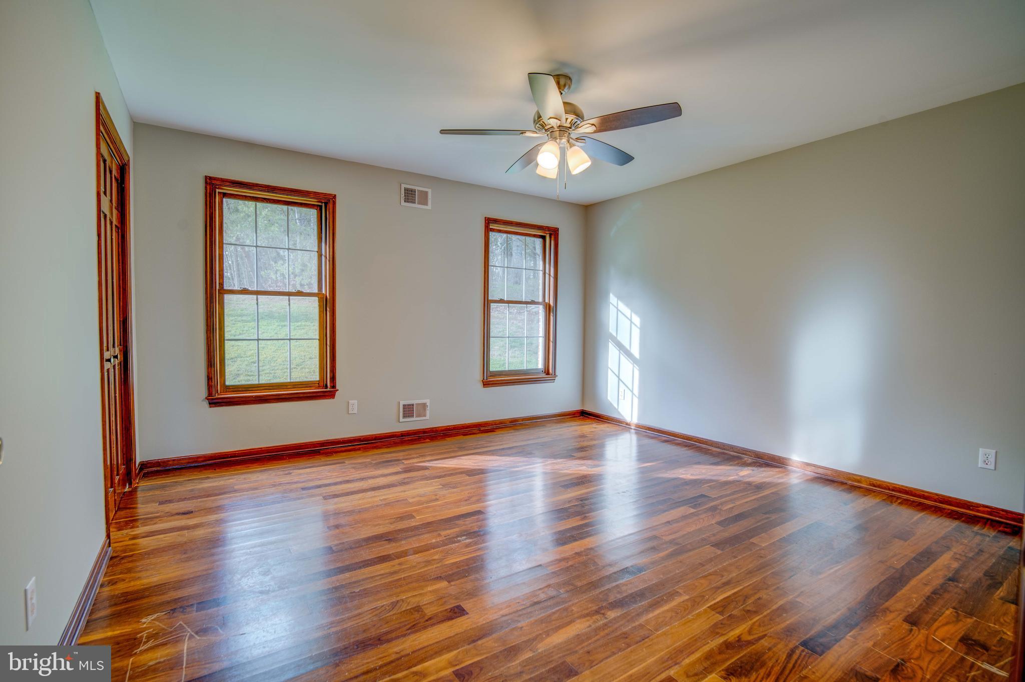 49530 Will's Road Dameron, MD 20628 - Photo 19 of 51 a view of an empty room with window and wooden floor
