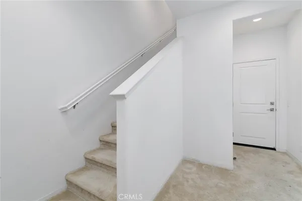 a view of entryway with stairs