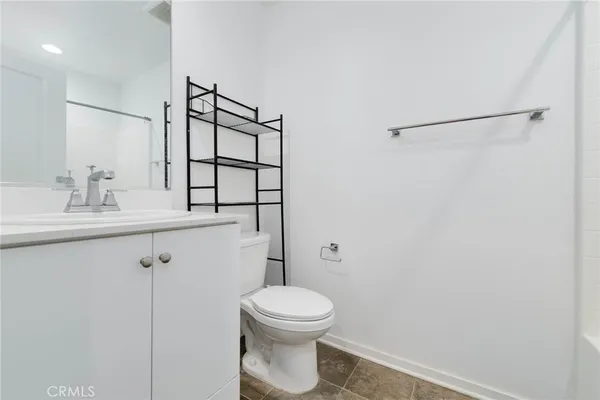 a bathroom with a toilet a sink and a shower