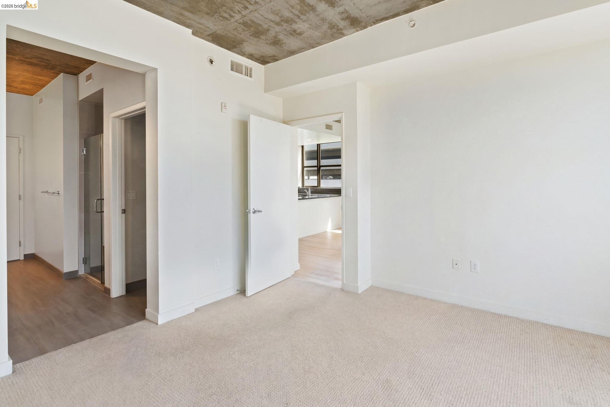 311 2nd Street, Unit 511 Oakland, CA 94607 - Photo 25 of 44 Unfurnished bedroom featuring light colored carpet