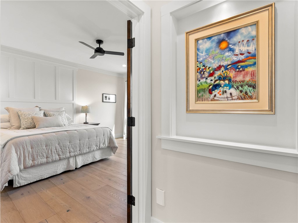 331 Bakerville Road Easley, SC 29642 - Photo 18 of 43 This serene bedroom offers a peaceful retreat with light-toned wooden flooring and elegant paneling.