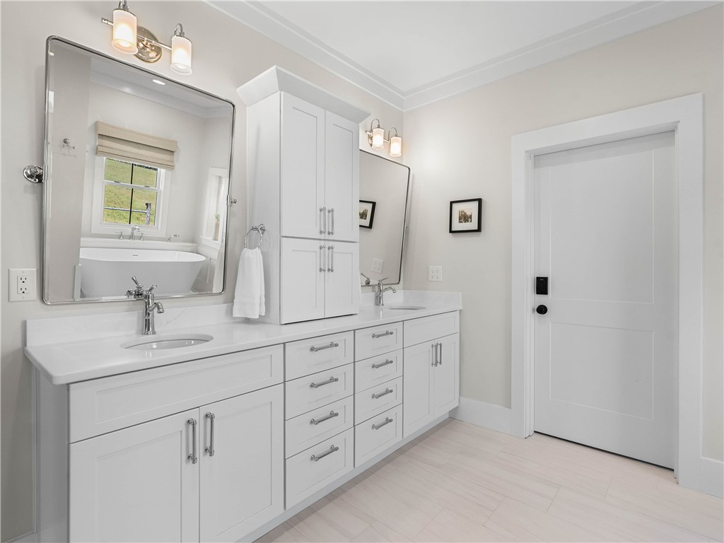 331 Bakerville Road Easley, SC 29642 - Photo 20 of 43 This bright bathroom features ample storage and a sleek vanity with double sinks.