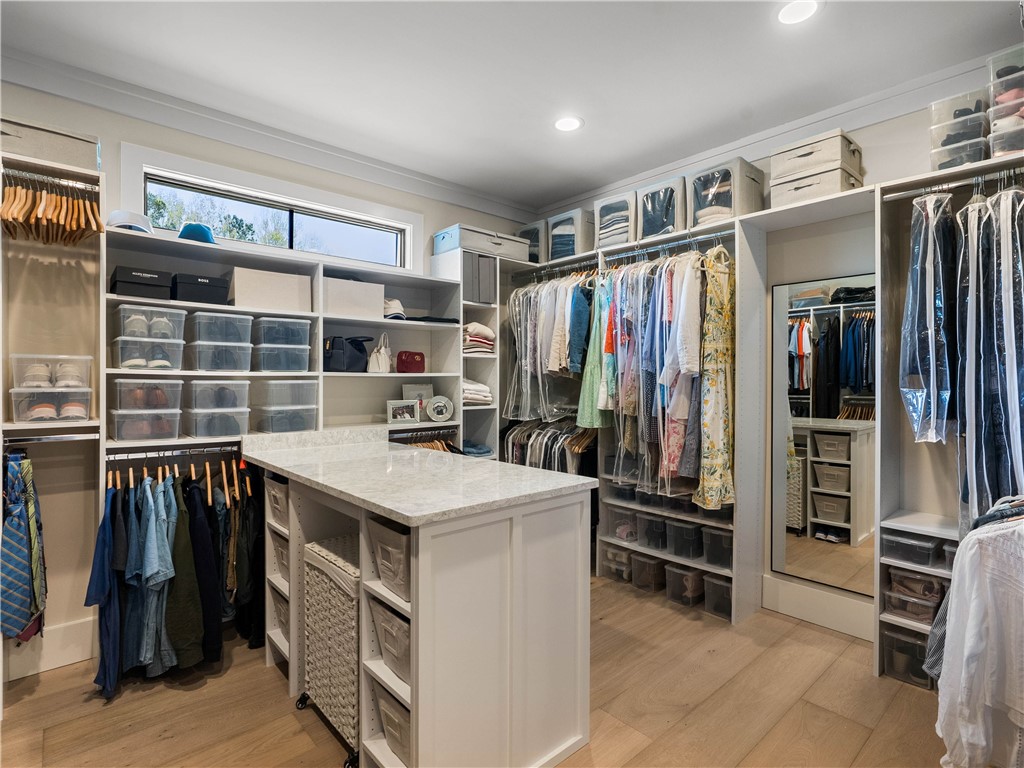 331 Bakerville Road Easley, SC 29642 - Photo 24 of 43 This spacious walk-in closet features abundant storage solutions and an elegant central island with a beautiful countertop.
