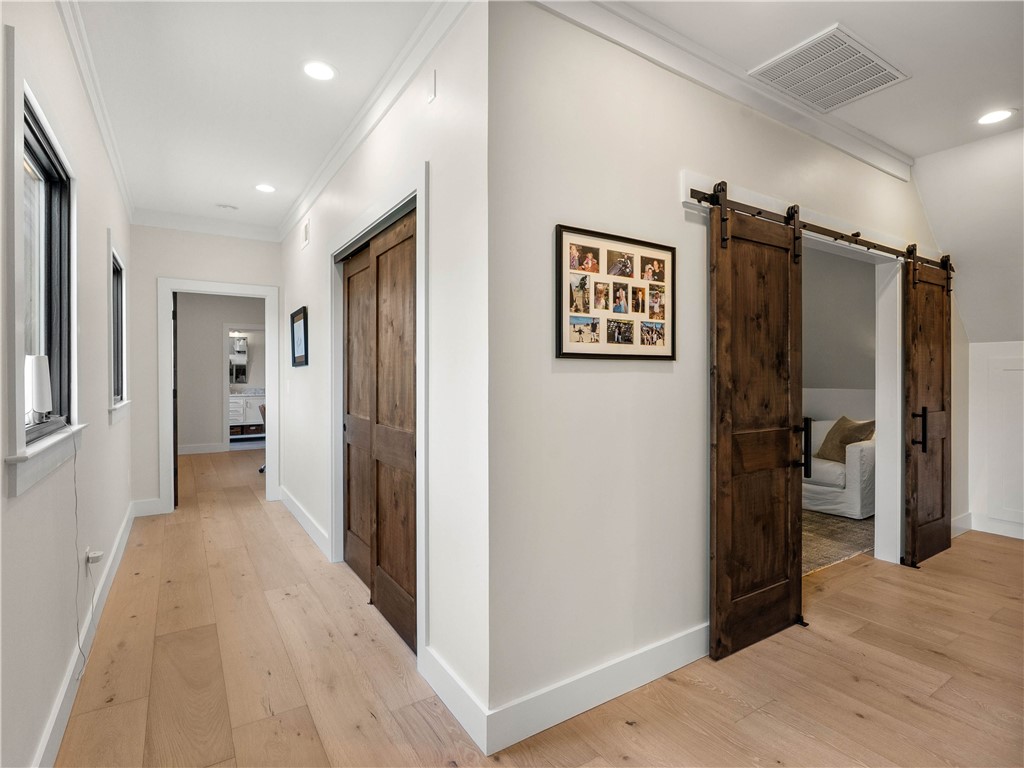 331 Bakerville Road Easley, SC 29642 - Photo 25 of 43 This bright hallway showcases hardwood flooring and elegant recessed lighting.