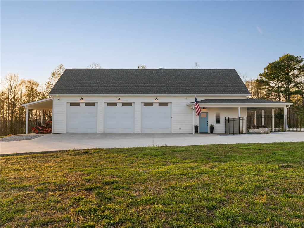 331 Bakerville Road Easley, SC 29642 - Photo 31 of 43 This spacious detached garage offers ample storage and workshop potential for all your needs.