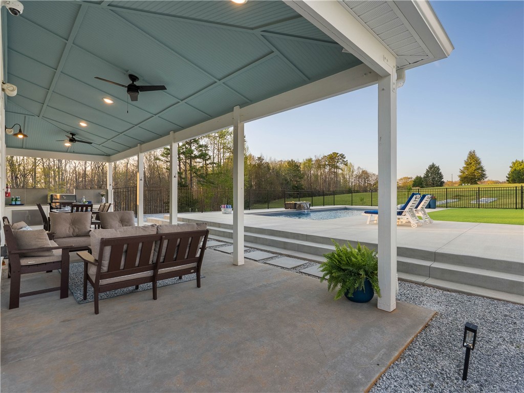 331 Bakerville Road Easley, SC 29642 - Photo 40 of 43 An inviting outdoor living space seamlessly connects with a sparkling pool area.