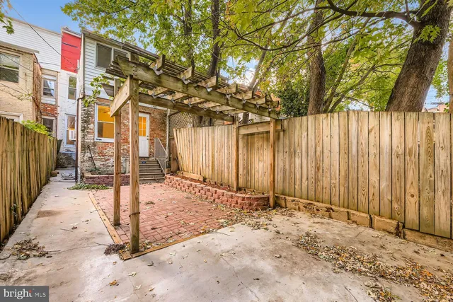 a view of a house with a snow on the road