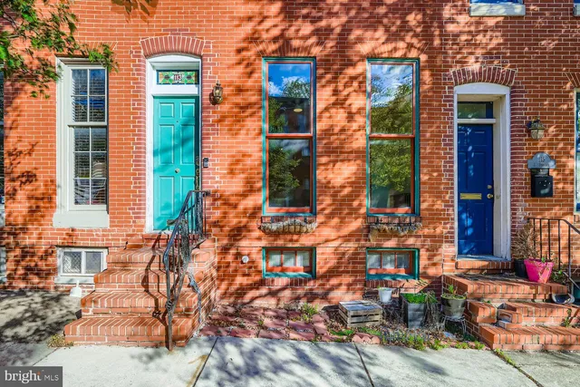a view of cars parked in front of a building