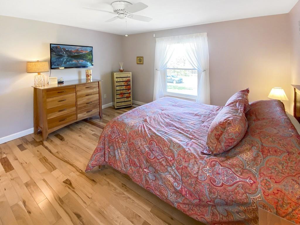10 Weather Deck Road Bourne, MA 02532 - Photo 18 of 37 a bedroom with a bed and a window