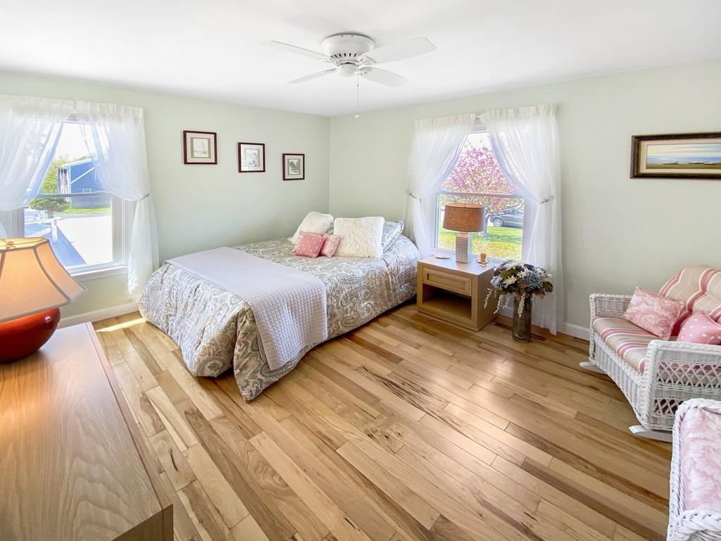 10 Weather Deck Road Bourne, MA 02532 - Photo 21 of 37 a bedroom with a bed wooden floor and window
