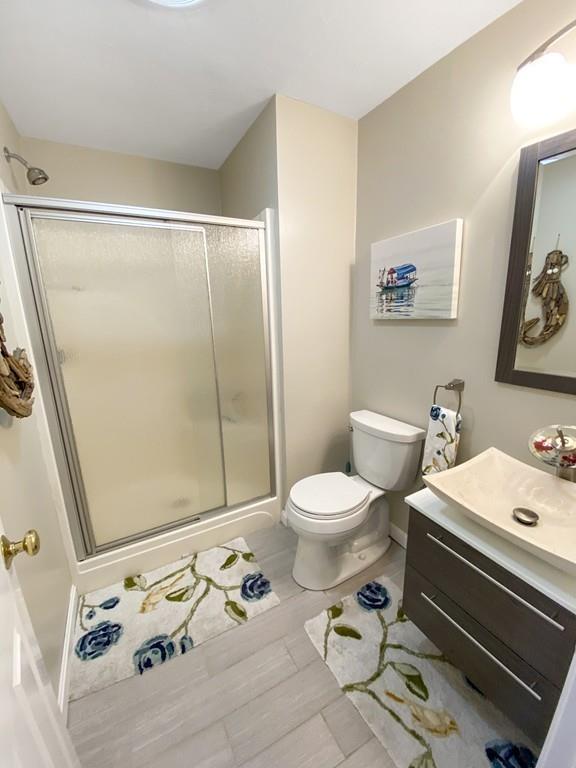 10 Weather Deck Road Bourne, MA 02532 - Photo 23 of 37 a bathroom with a toilet sink and mirror