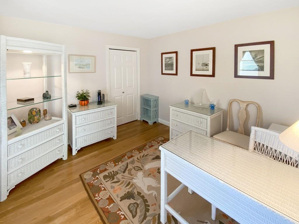 10 Weather Deck Road Bourne, MA 02532 - Photo 24 of 37 a room with a bed and a table