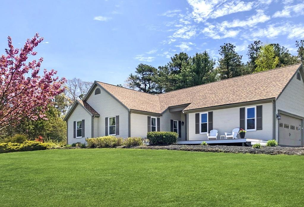 10 Weather Deck Road Bourne, MA 02532 - Photo 25 of 37 a front view of house with yard and green space