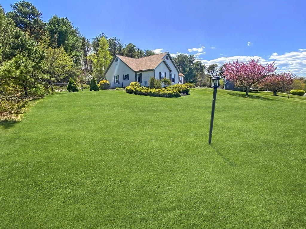 10 Weather Deck Road Bourne, MA 02532 - Photo 29 of 37 a view of a house with a backyard