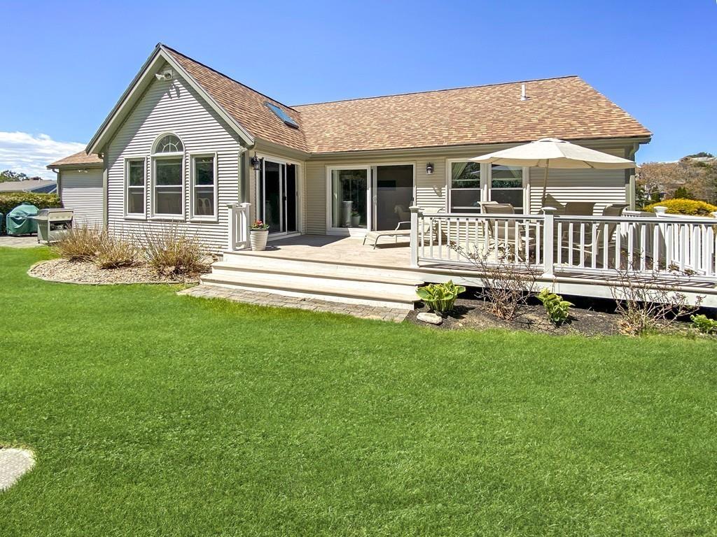 10 Weather Deck Road Bourne, MA 02532 - Photo 32 of 37 a view of a house with a yard and sitting area